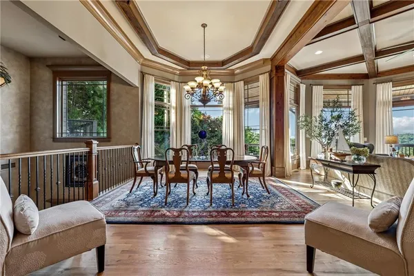 a living room with a couch and large windows