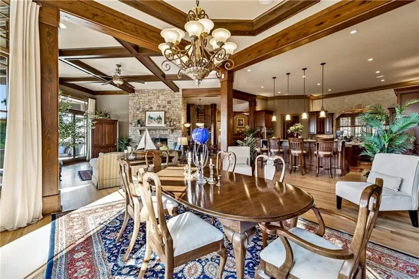 a living room with patio furniture and a fireplace