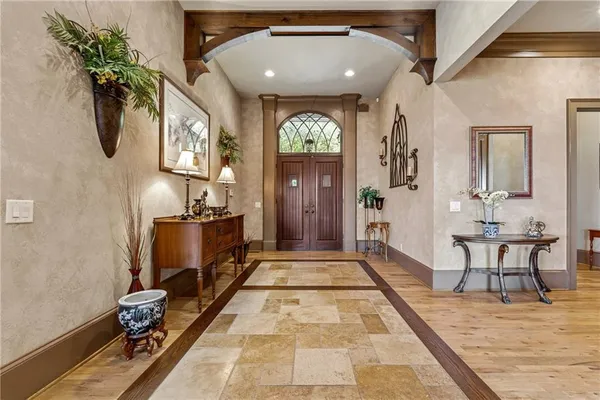 a kitchen with stainless steel appliances granite countertop a sink stove and cabinets
