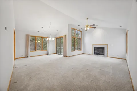 a view of an empty room with a fireplace