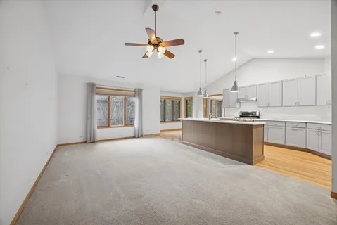 a view of a kitchen with a sink and a window