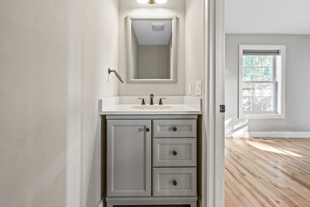 41 Glendale Street Chicopee, MA 01020 - Photo 14 of 42 a bathroom with a sink and a mirror