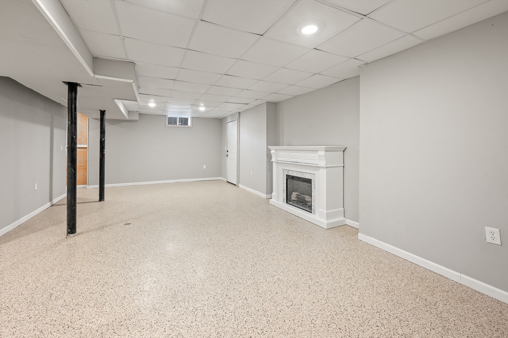 41 Glendale Street Chicopee, MA 01020 - Photo 33 of 42 en empty room with windows and fireplace