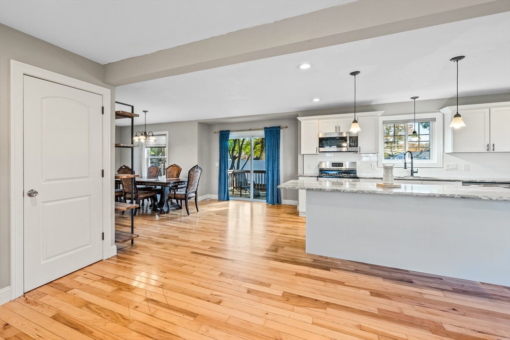 41 Glendale Street Chicopee, MA 01020 - Photo 7 of 42 a kitchen with stainless steel appliances granite countertop a refrigerator a stove and a wooden floors