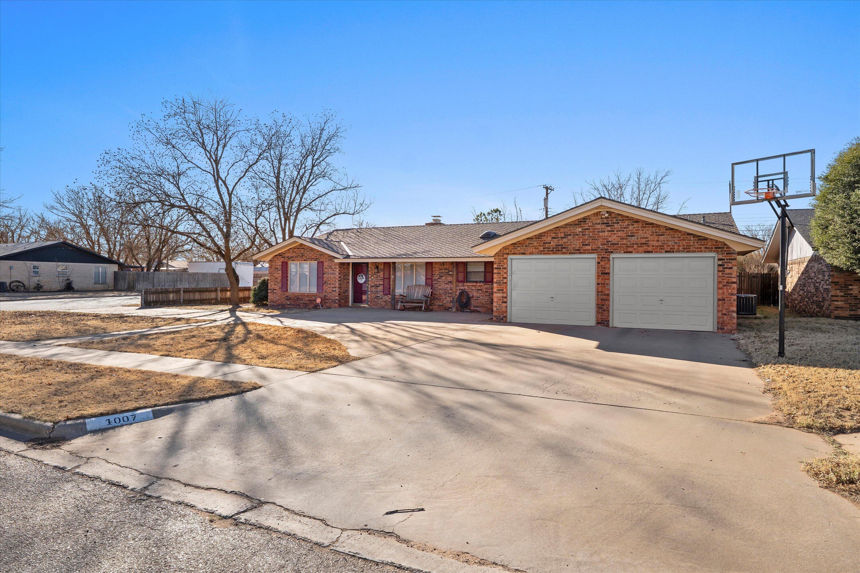 1007 South Howell Street Brownfield, TX 79316 - Photo 18 of 18 a front view of a house with a yard