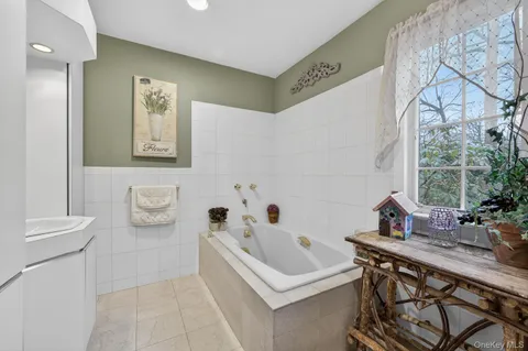 a spacious bedroom with a bed and furniture