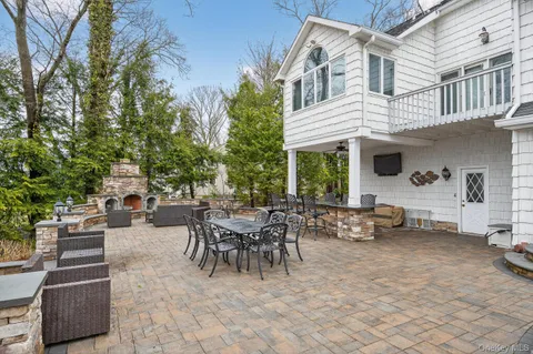 a view of a patio with couches and a fire pit