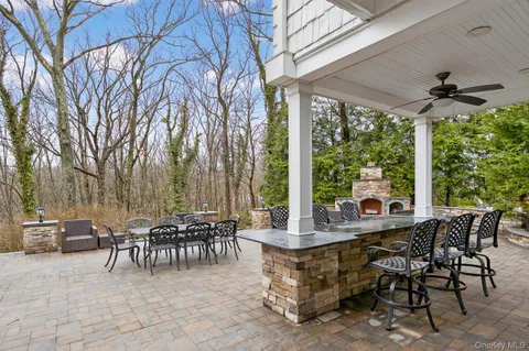 a view of a patio with table and chairs