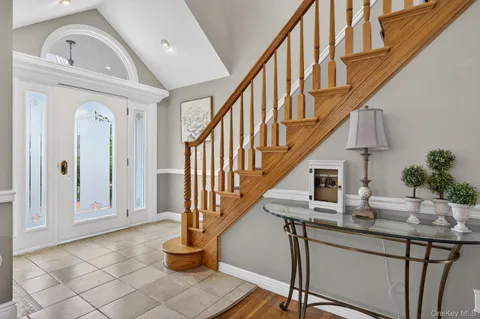 a living room with fireplace furniture and a wooden floor