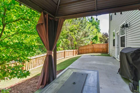 a view of backyard with green space