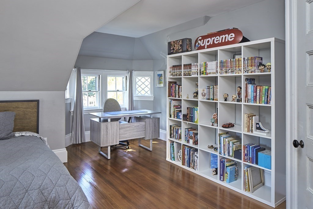 20 Orient Avenue Newton, MA 02459 - Photo 13 of 18 a room with a book shelf and a book shelf
