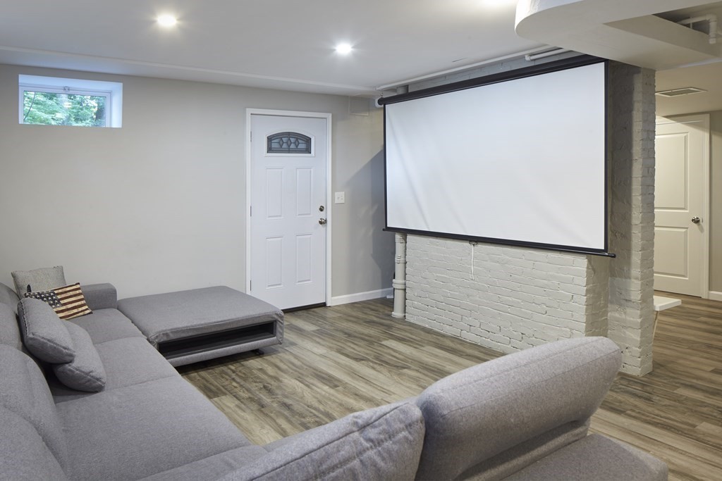 20 Orient Avenue Newton, MA 02459 - Photo 15 of 18 a bedroom with a bed and a couch