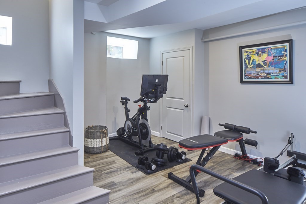 20 Orient Avenue Newton, MA 02459 - Photo 17 of 18 a view of a workspace with furniture and stairs