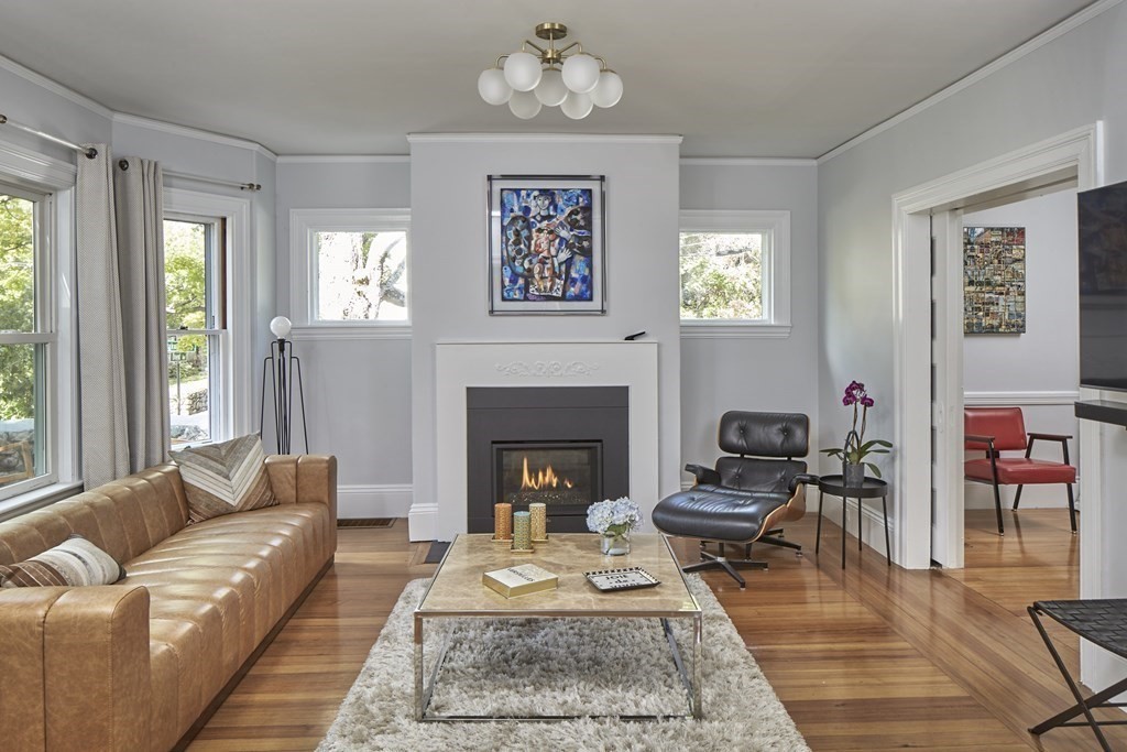 20 Orient Avenue Newton, MA 02459 - Photo 4 of 18 a living room with furniture and a fireplace