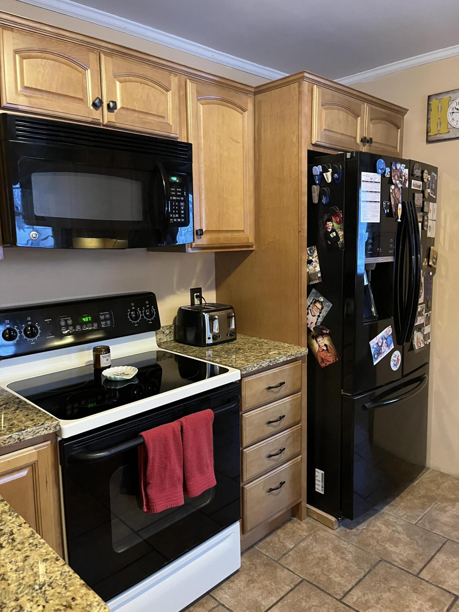8 Lincoln Street Presque Isle, ME 04769 - Photo 7 of 28 Kitchen Range & Refrigerator