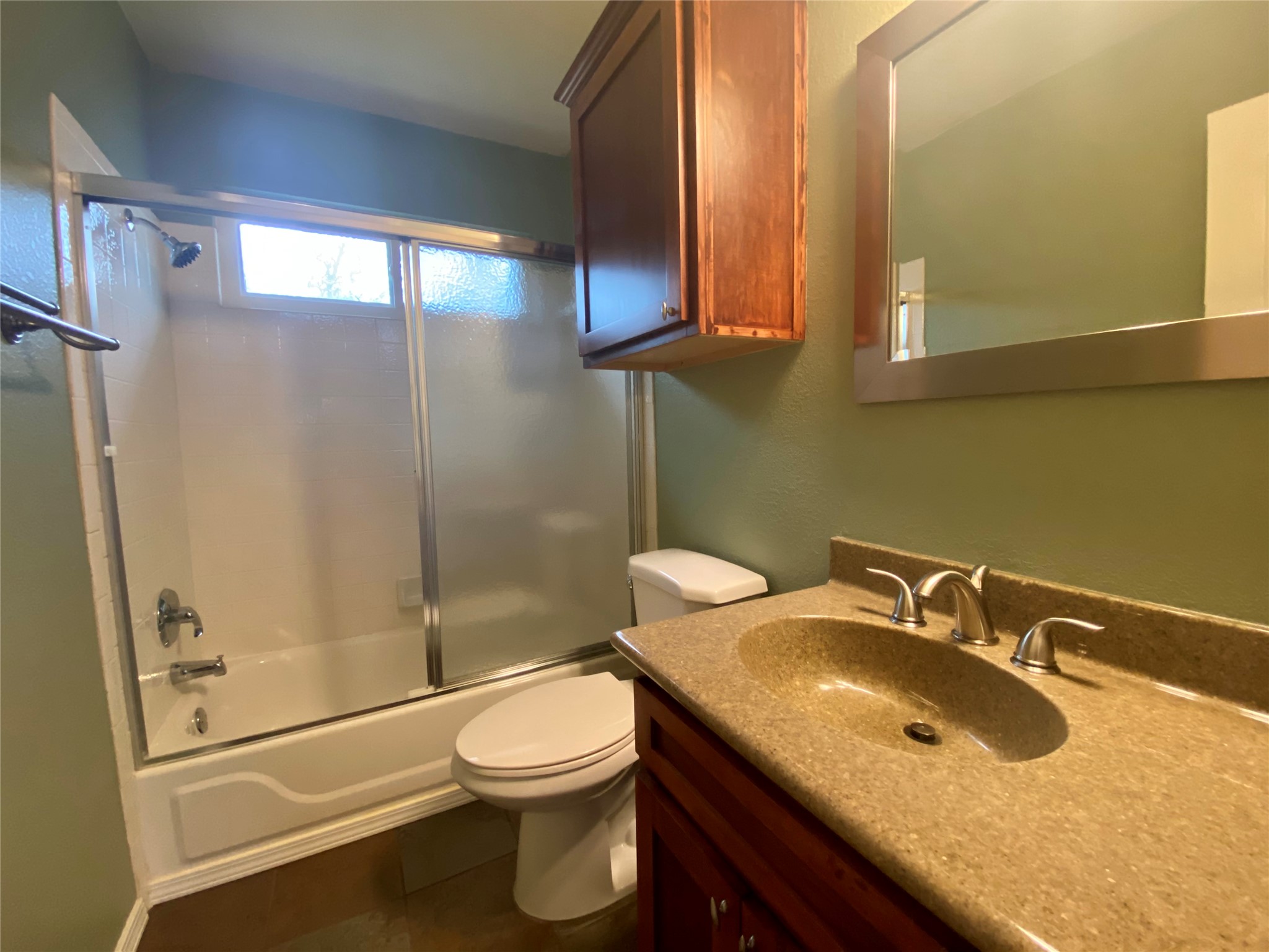 4615 Tello Path Austin, TX 78749 - Photo 21 of 29 Functional full bathroom featuring a tub-shower combination, a vanity with a sleek countertop, and a medicine cabinet.