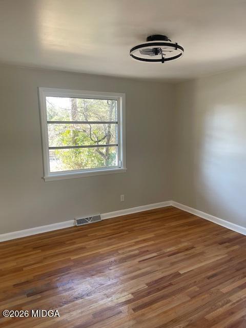 3688 Jessica Drive Macon, GA 31217 - Photo 11 of 14 a view of an empty room with wooden floor and a window