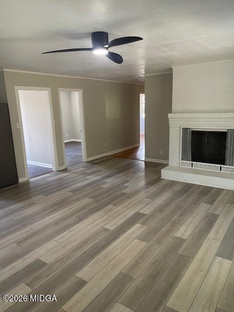 3688 Jessica Drive Macon, GA 31217 - Photo 4 of 14 an empty room with wooden floor fireplace and windows