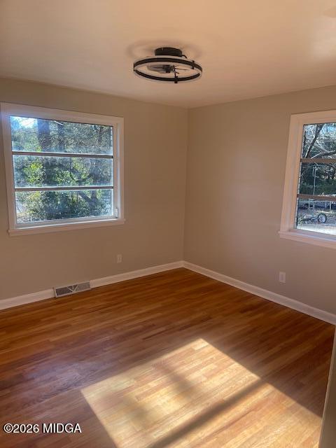 3688 Jessica Drive Macon, GA 31217 - Photo 9 of 14 a view of an empty room with wooden floor and a window