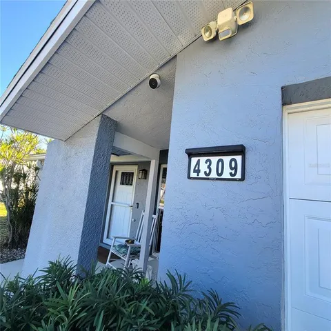 wooden floor in an empty room and a window
