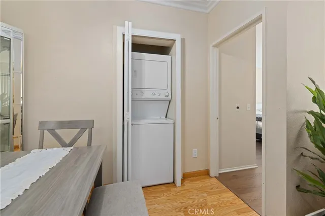 a room that has a bed and a plant in it