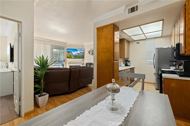 a living room with furniture a large window with wooden floor