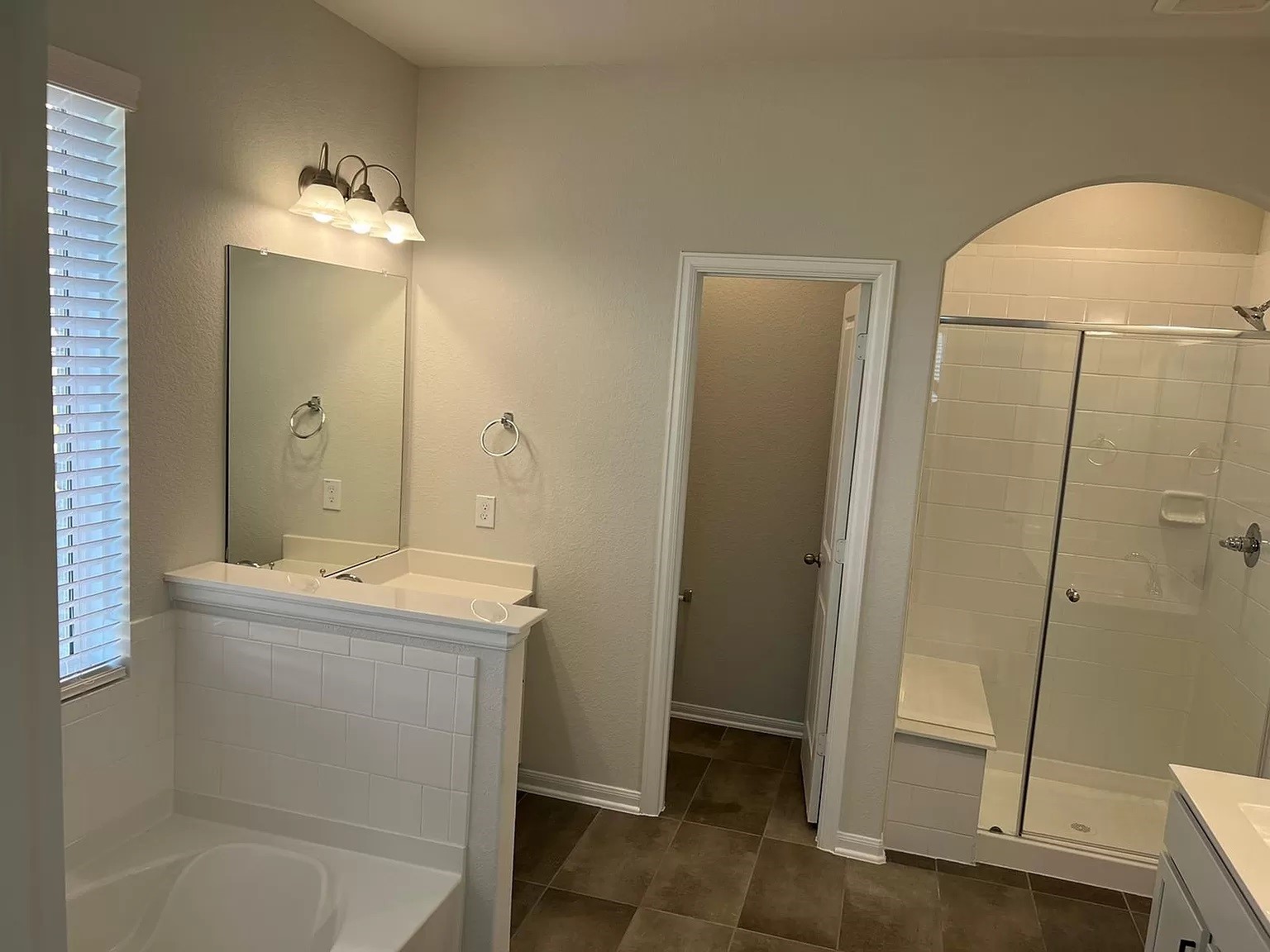 21219 Bering Reach Drive Cypress, TX 77433 - Photo 17 of 26 a bathroom with a shower a sink and a mirror