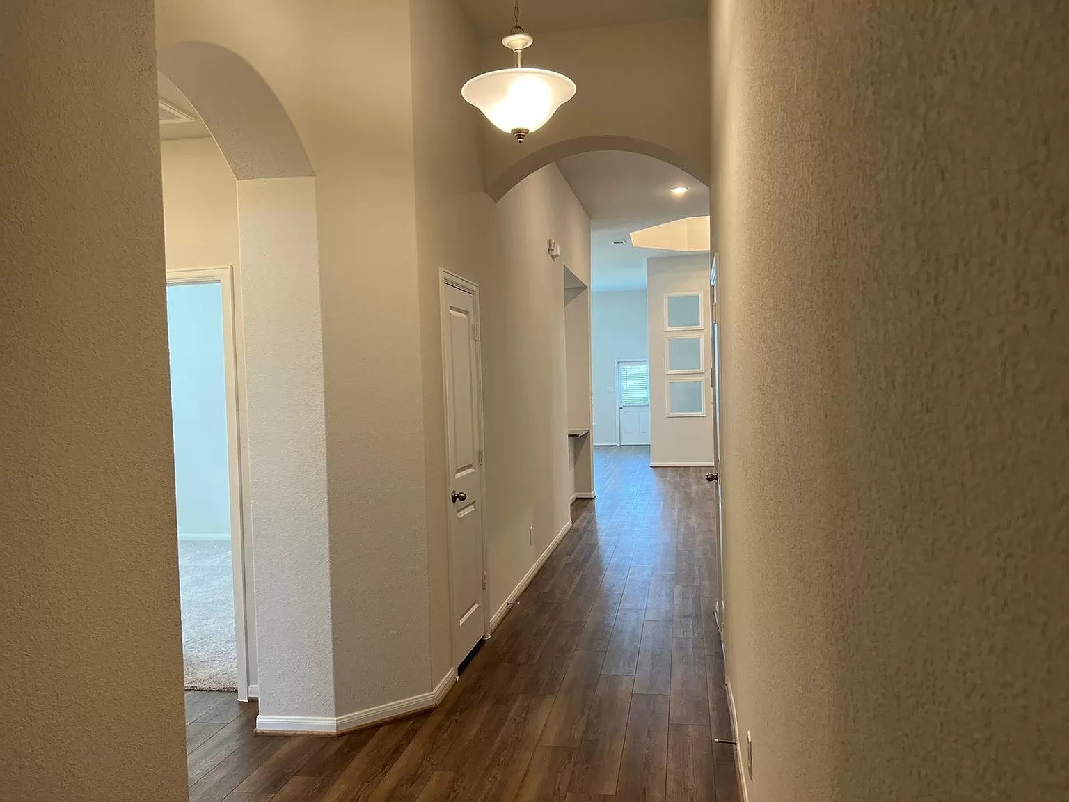 21219 Bering Reach Drive Cypress, TX 77433 - Photo 18 of 26 a view of a hallway with wooden floor
