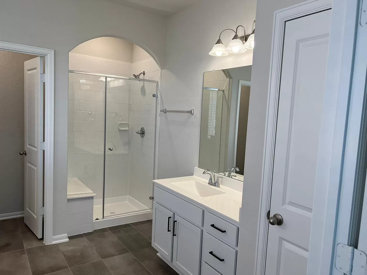 21219 Bering Reach Drive Cypress, TX 77433 - Photo 6 of 26 a bathroom with a shower sink and mirror