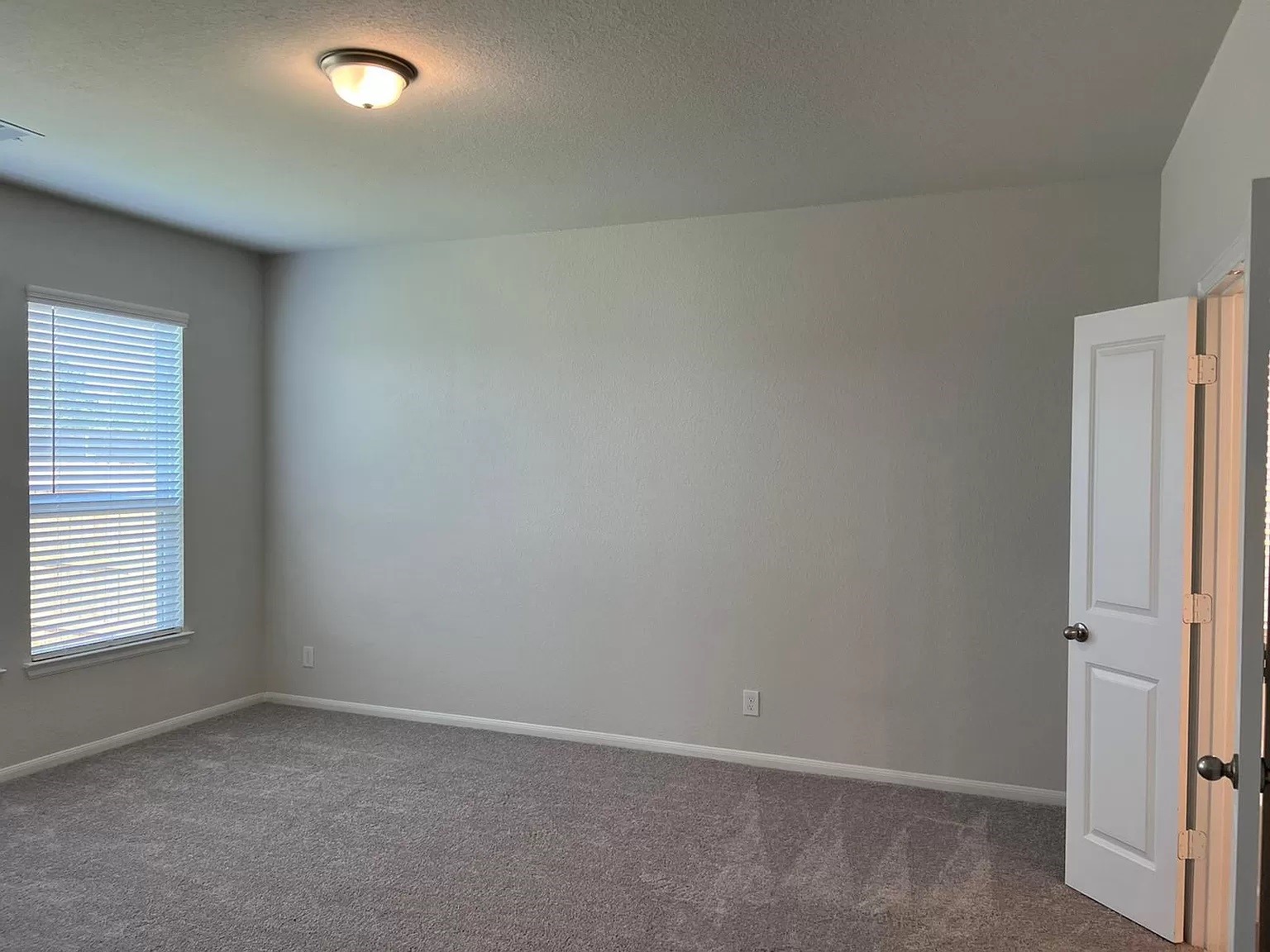 21219 Bering Reach Drive Cypress, TX 77433 - Photo 7 of 26 an empty room with windows