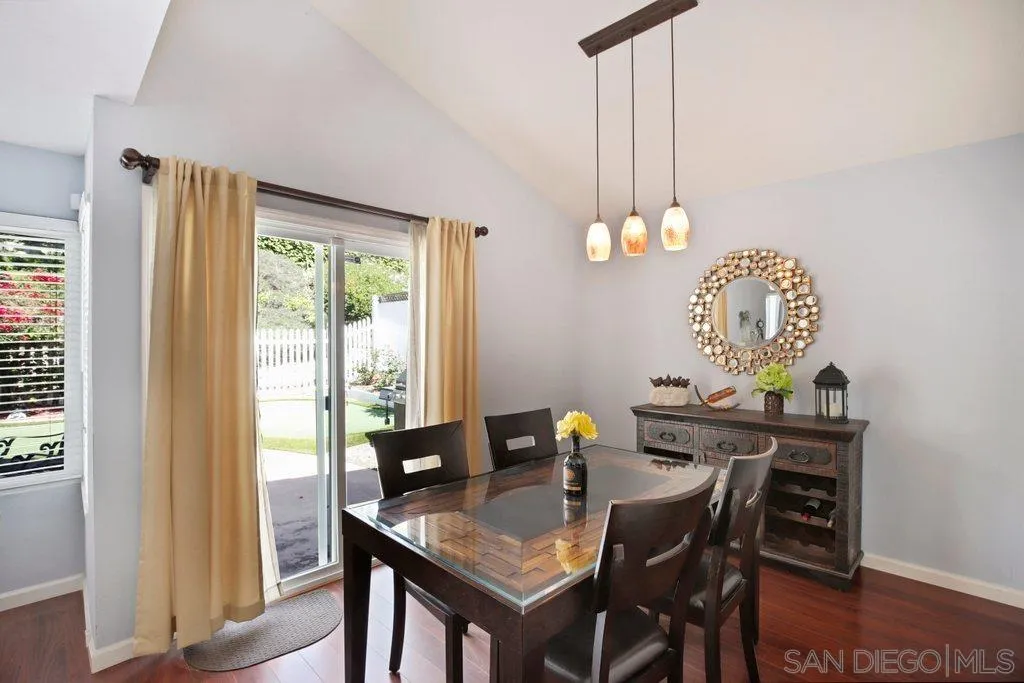13547 Ridley Road San Diego, CA 92129 - Photo 7 of 24 a view of a dining room with a table and chairs