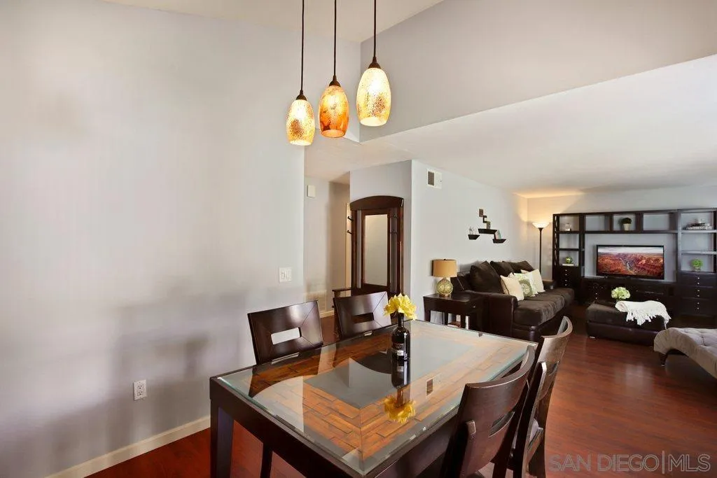 13547 Ridley Road San Diego, CA 92129 - Photo 8 of 24 a view of a dining room with furniture and wooden floor
