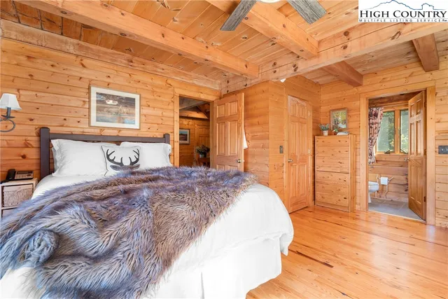 a bedroom with a bed and a walk in closet