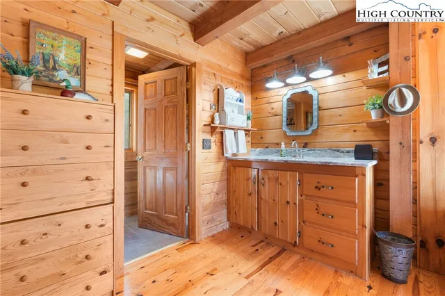 a bathroom with a sink a vanity and a mirror