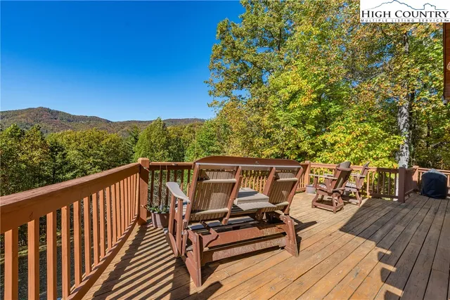 a view of balcony with wooden floor and outdoor seating