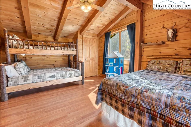 a bedroom with a large bed and a large window