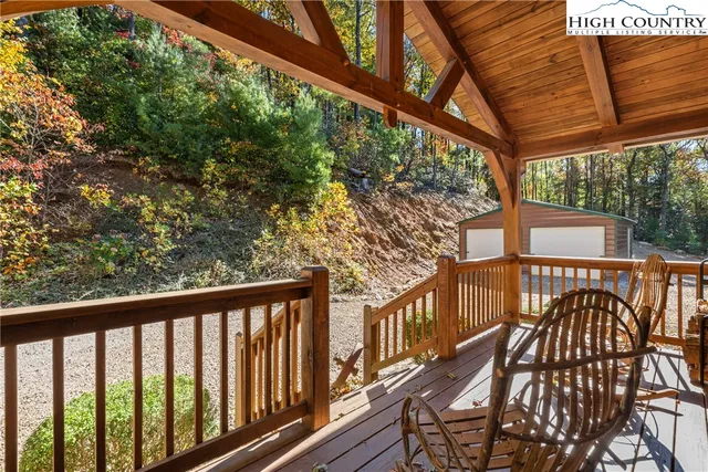 a view of a balcony with wooden floor