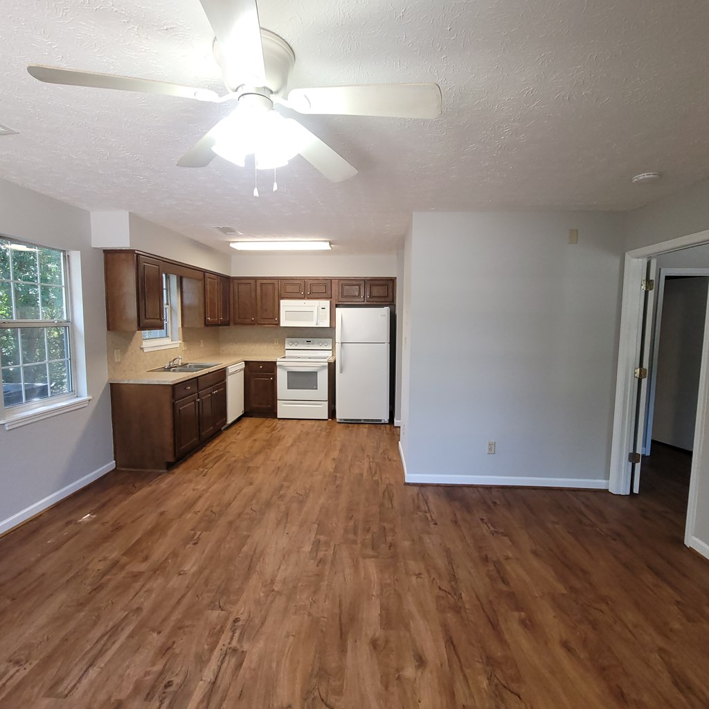 909 Washington Avenue, Unit 1 Columbus, GA 31906 - Photo 3 of 10 a view of a kitchen with a sink dishwasher cabinets and a kitchen