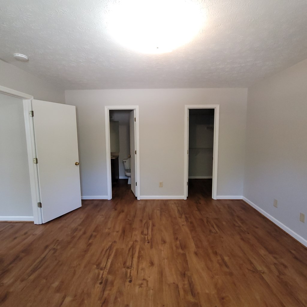 909 Washington Avenue, Unit 1 Columbus, GA 31906 - Photo 7 of 10 a view of an empty room with wooden floor