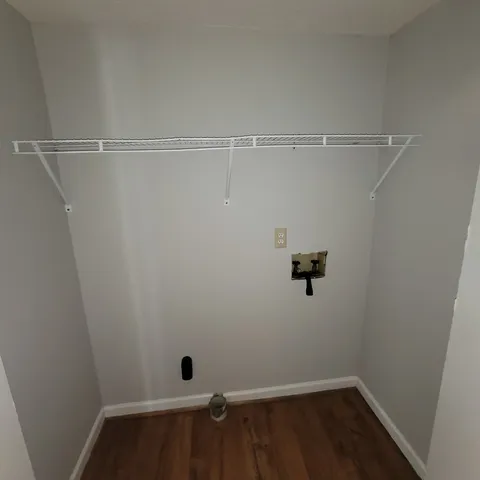 a view of a room with racks on the wall