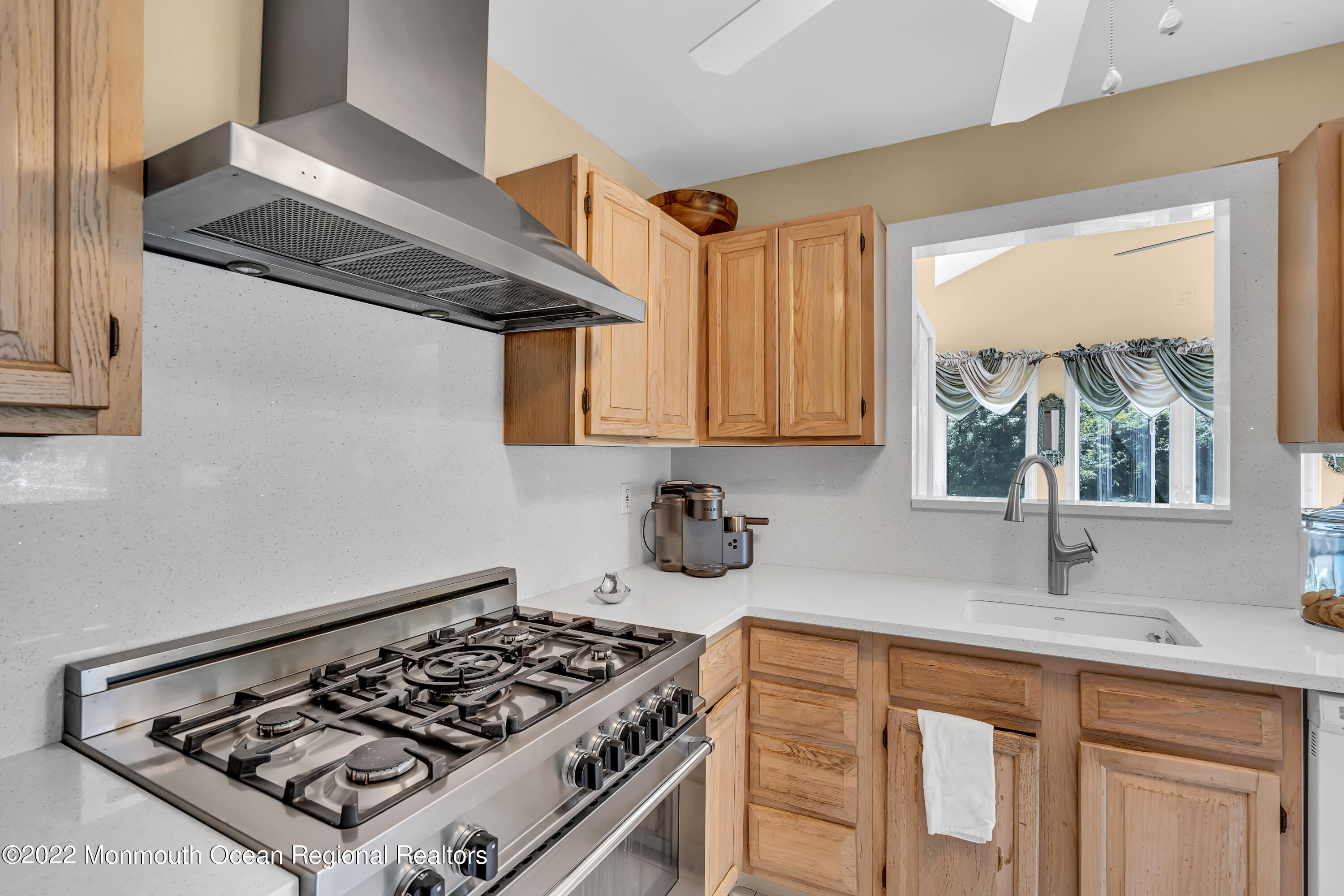 23 North Westfield Road Howell, NJ 07731 - Photo 15 of 55 a kitchen with stainless steel appliances a stove a sink dishwasher and cabinets with wooden floor