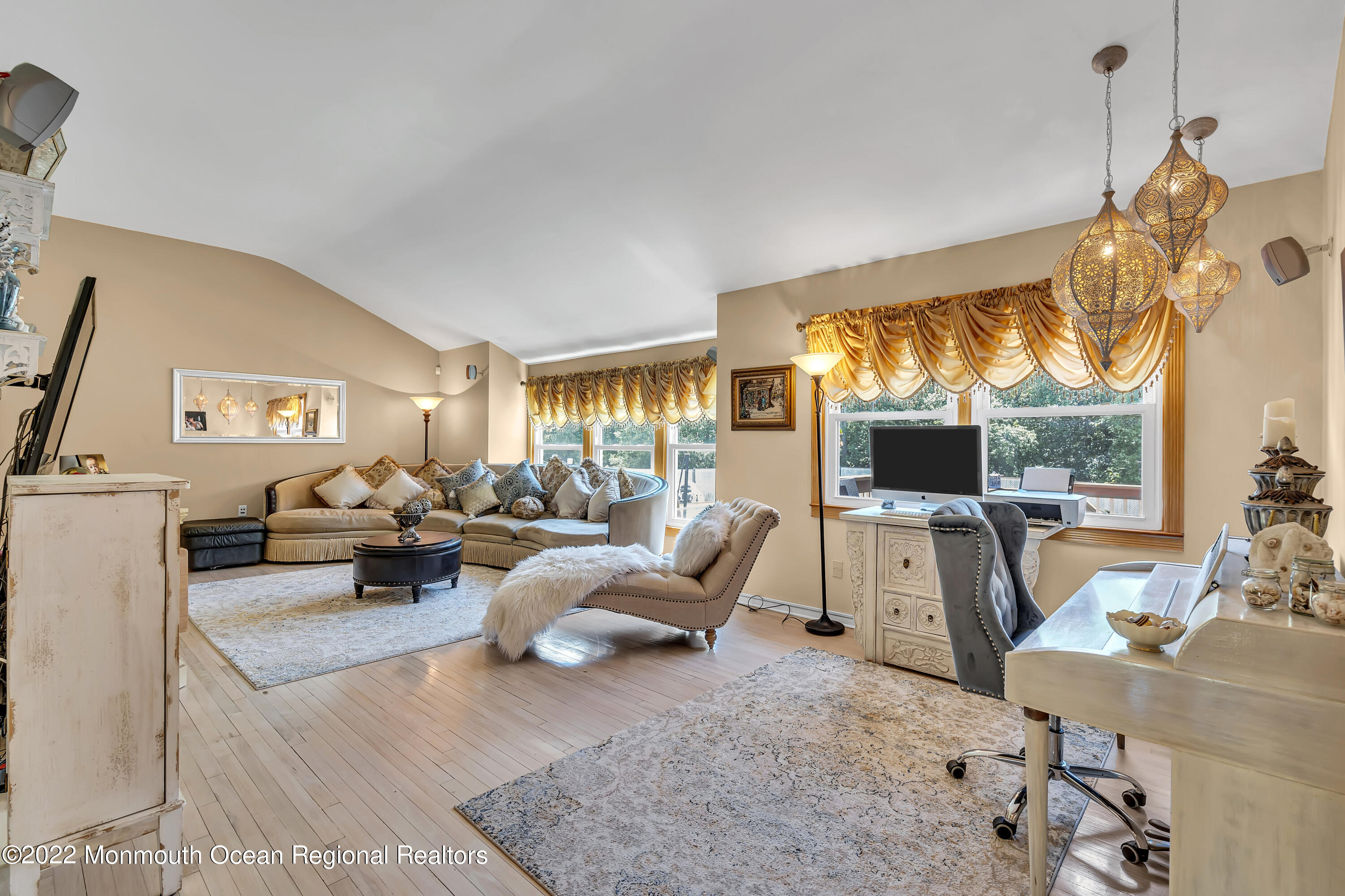 23 North Westfield Road Howell, NJ 07731 - Photo 24 of 55 a living room with furniture a flat screen tv and a large window