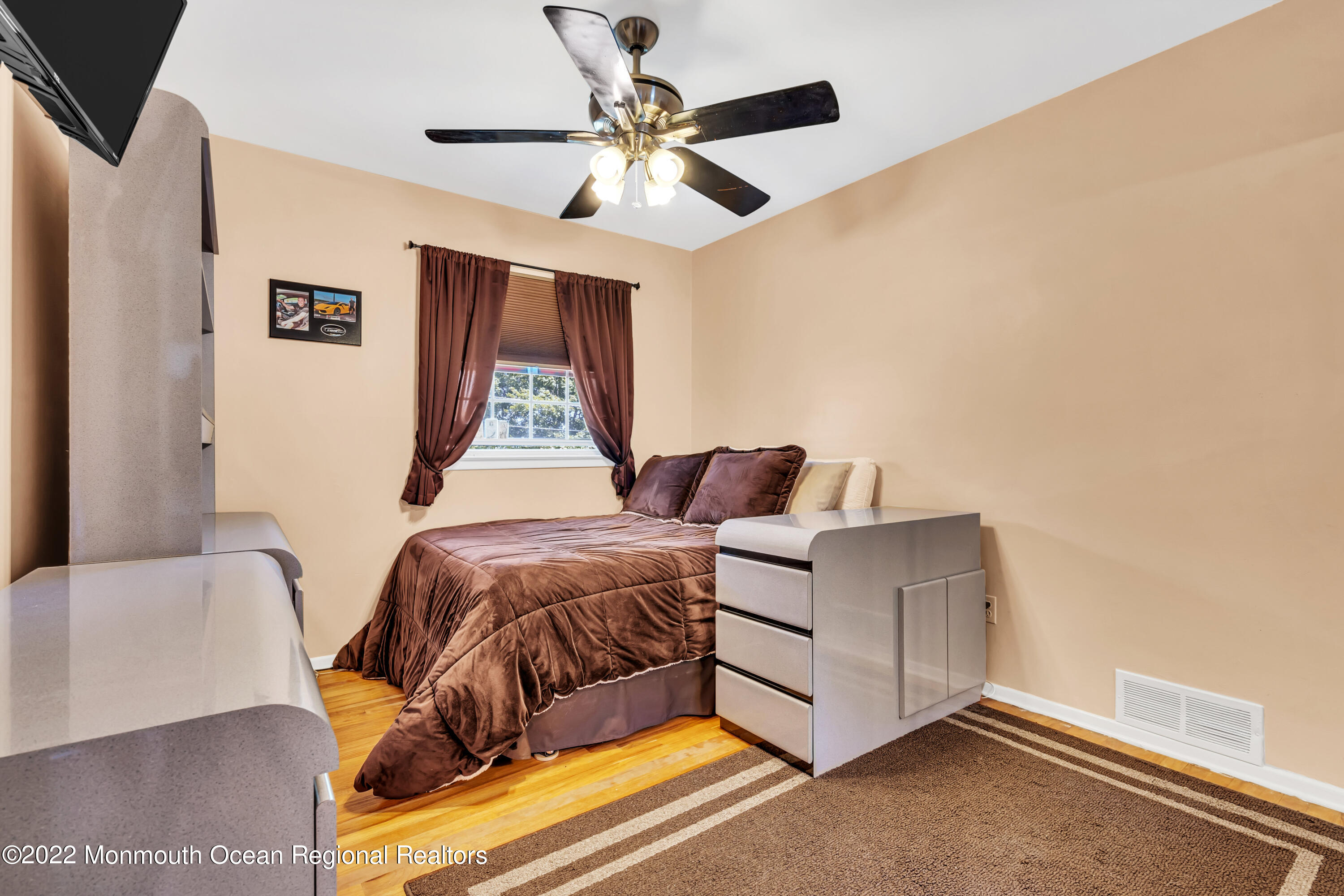 23 North Westfield Road Howell, NJ 07731 - Photo 35 of 55 a living room with furniture and a ceiling fan