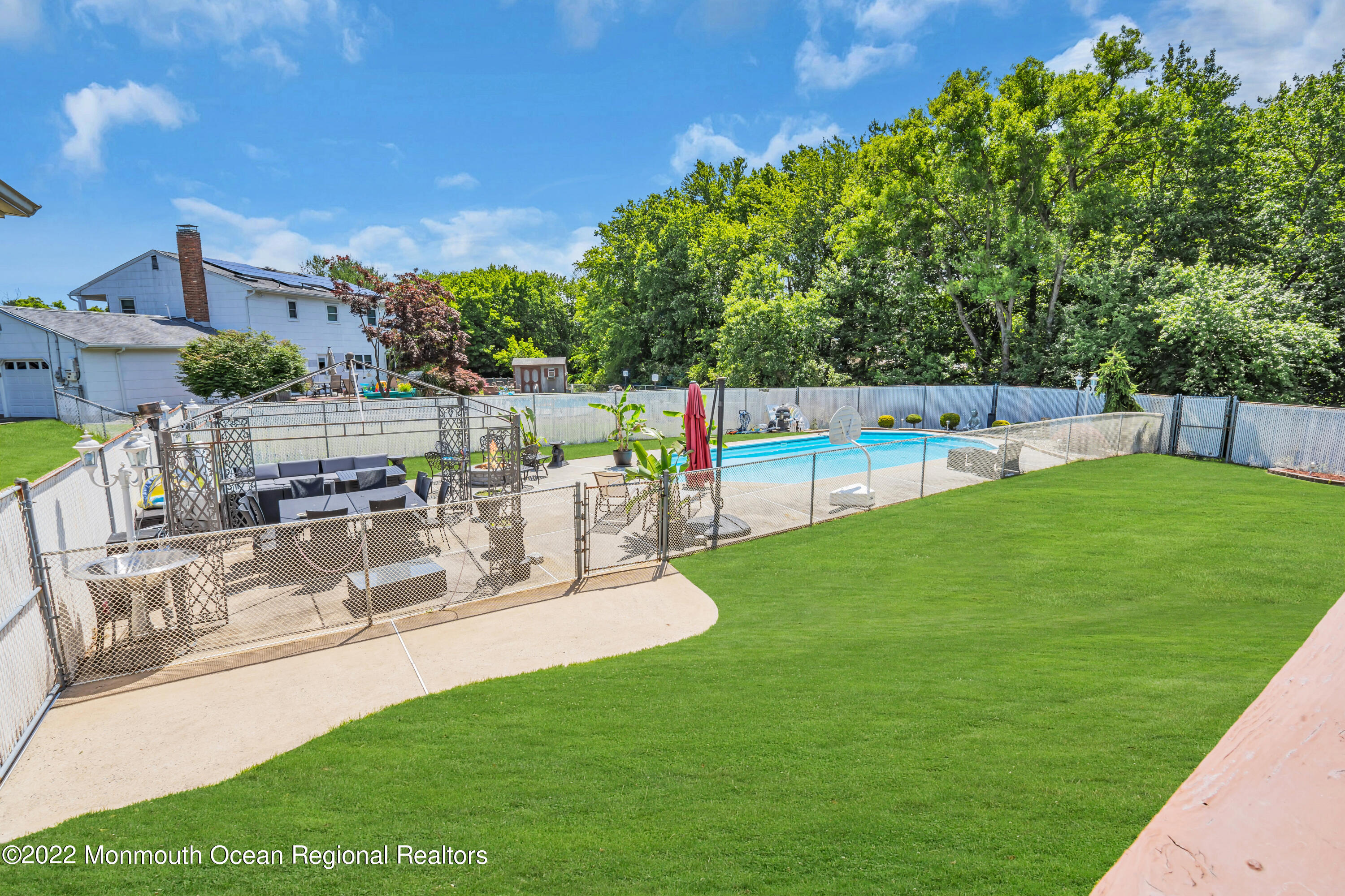 23 North Westfield Road Howell, NJ 07731 - Photo 45 of 55 a view of a swimming pool with a patio