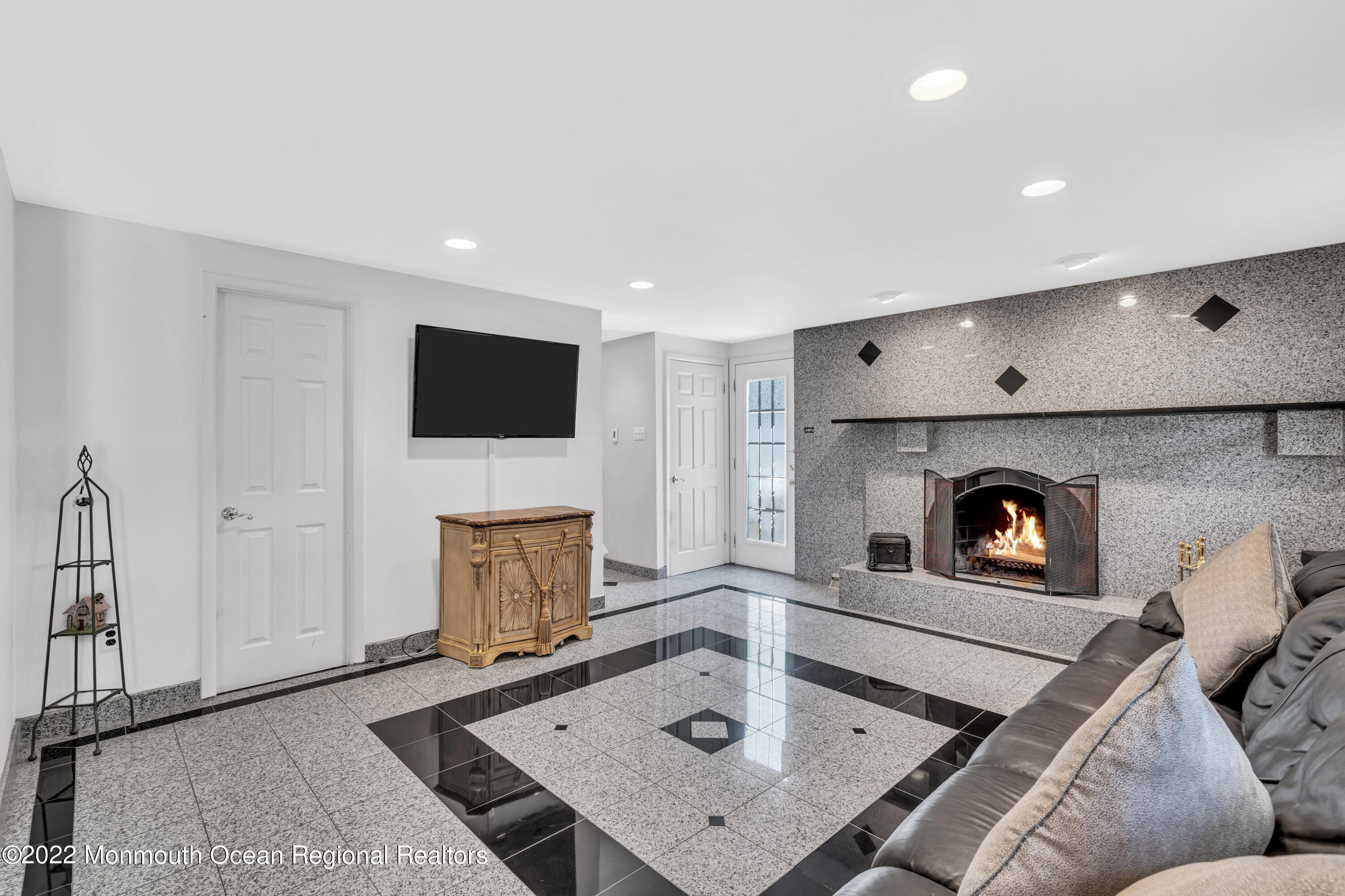 23 North Westfield Road Howell, NJ 07731 - Photo 6 of 55 a living room with furniture and a fireplace