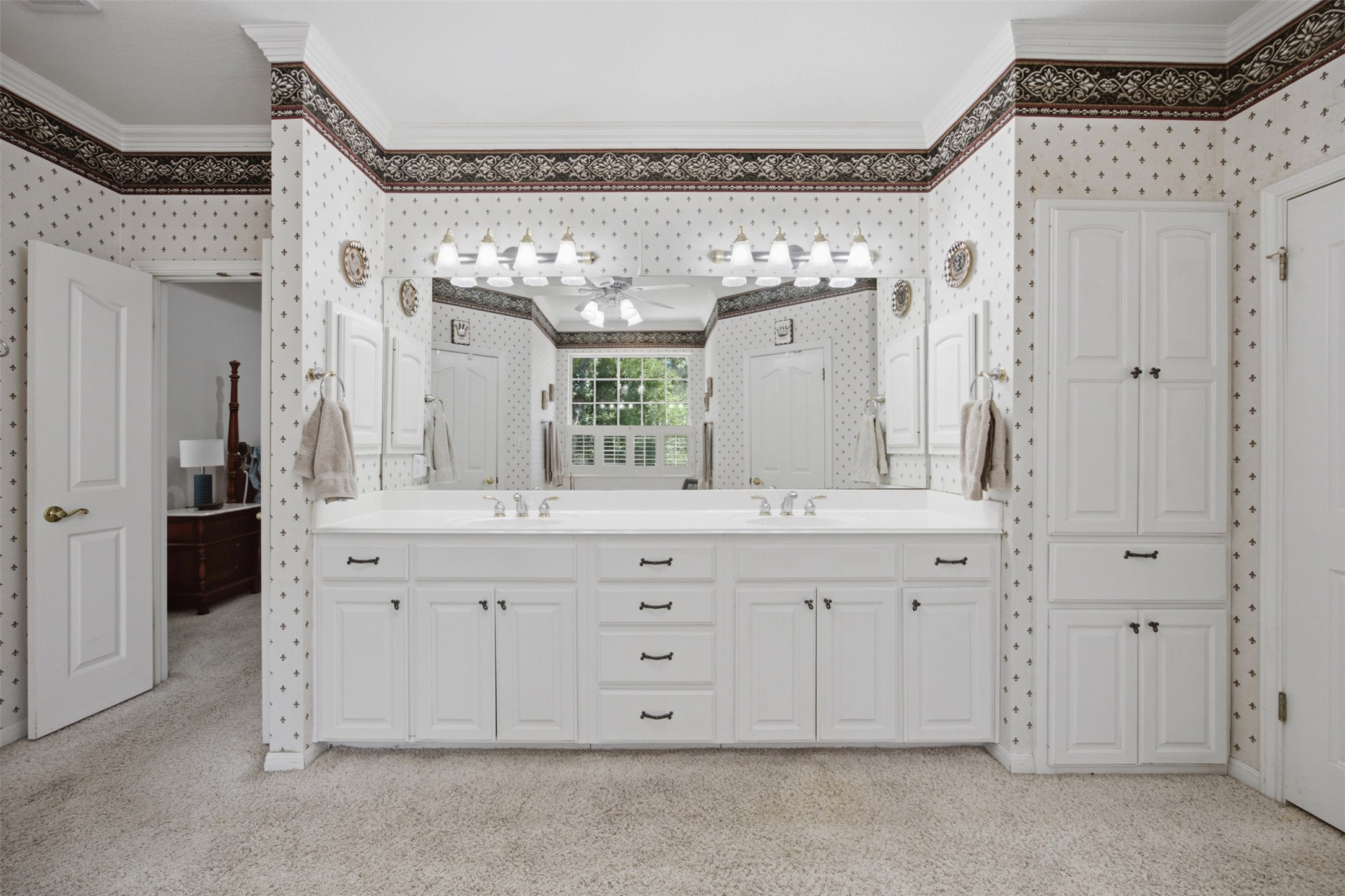 197 Elm Wood Drive Elgin, TX 78621 - Photo 23 of 37 Double vanity and ample storage solutions elevate this well-appointed bathroom space.