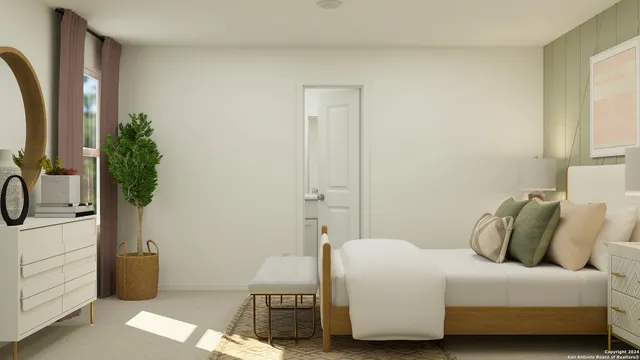 a bedroom with a bed and a potted plant
