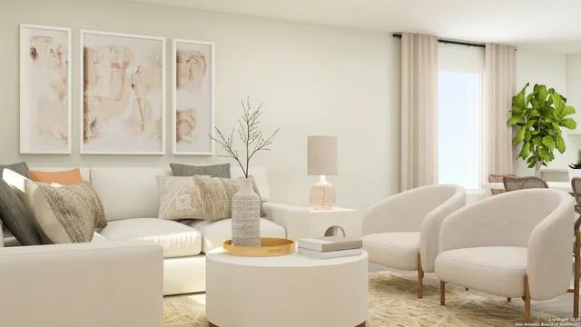 a living room with furniture and a potted plant