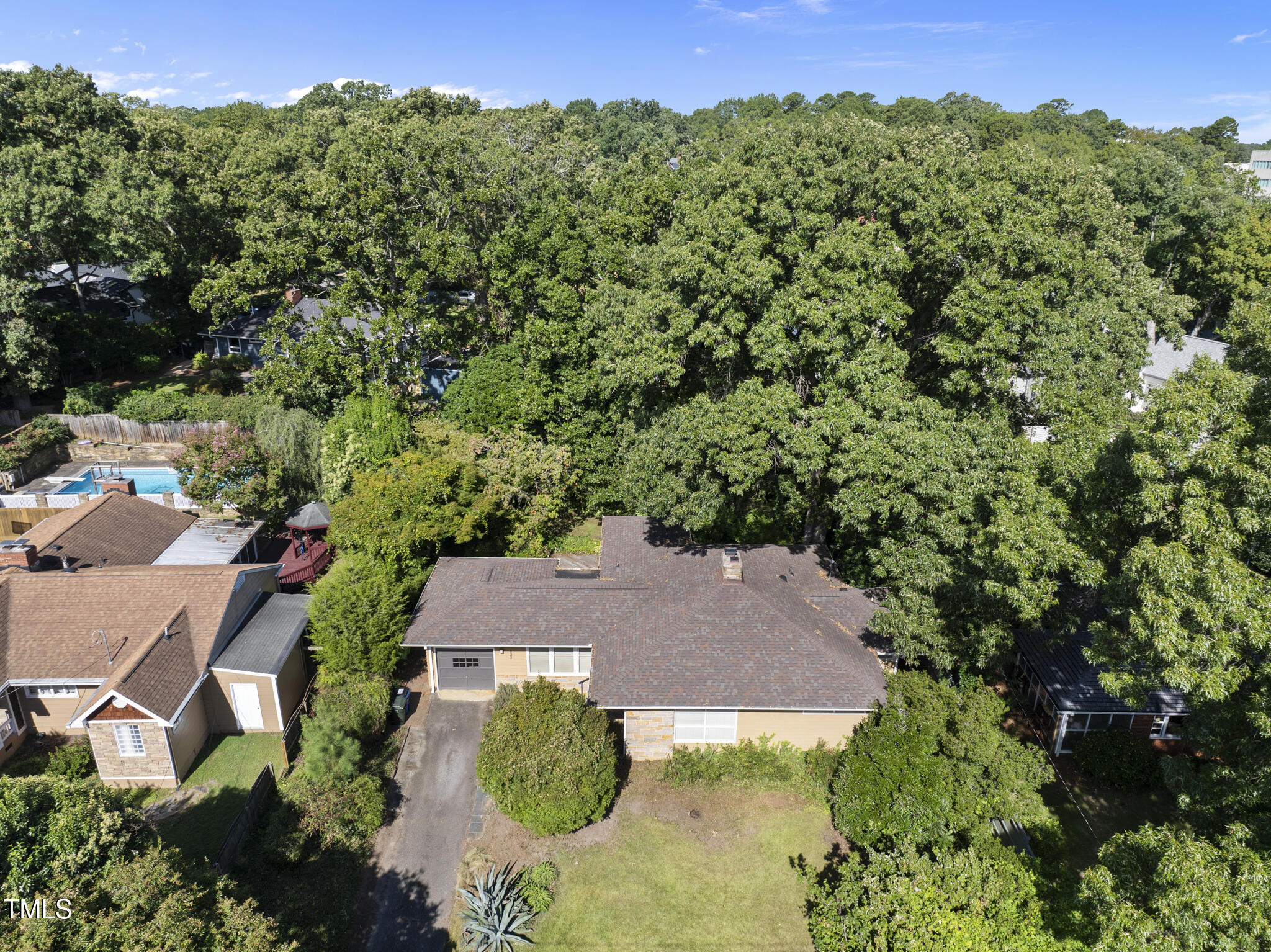 825 Woodburn Road Raleigh, NC 27605 - Photo 1 of 35 an aerial view of a house with yard and outdoor seating
