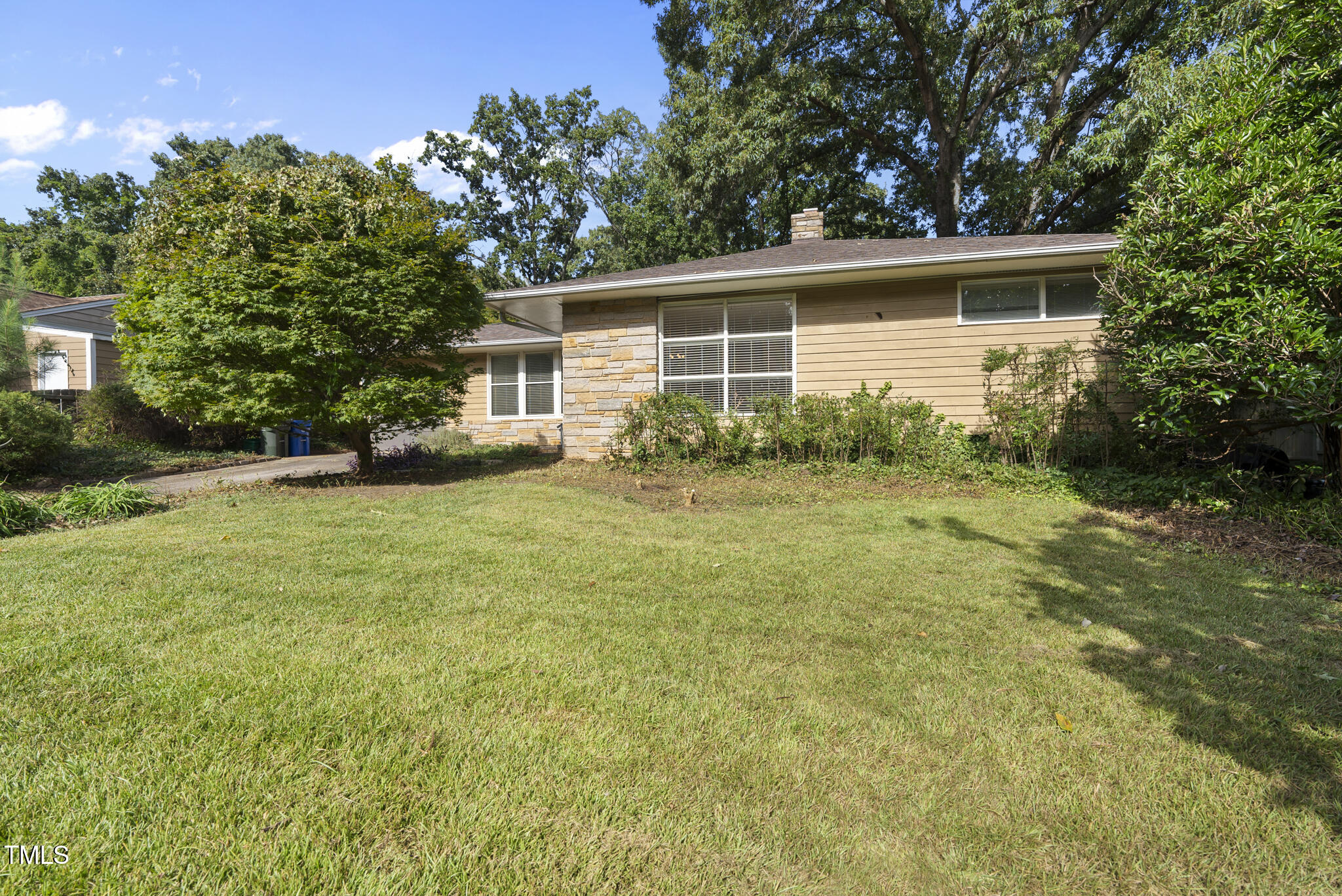 825 Woodburn Road Raleigh, NC 27605 - Photo 10 of 35 a view of a house with backyard and garden